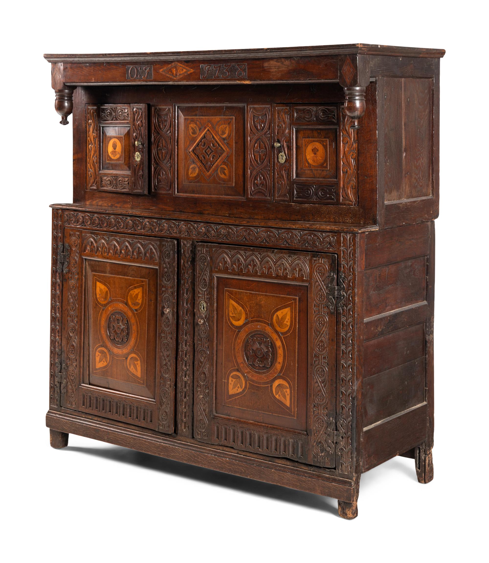 A Jacobean Carved Oak and Marquetry Court Cupboard