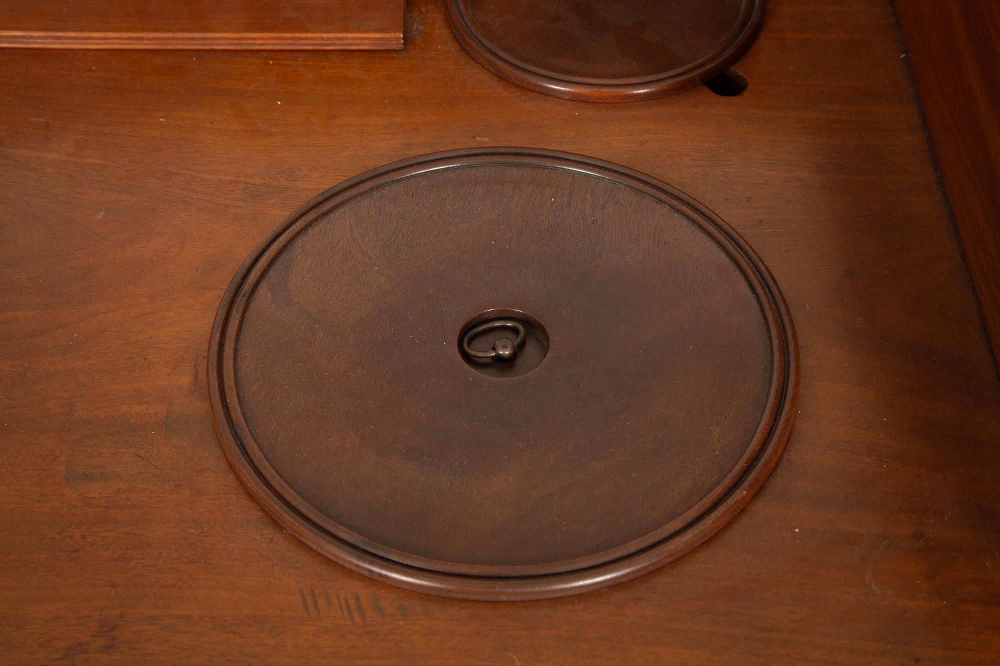 A Regency Mahogany Wash Stand with Original Covers for Bowl Cut-outs