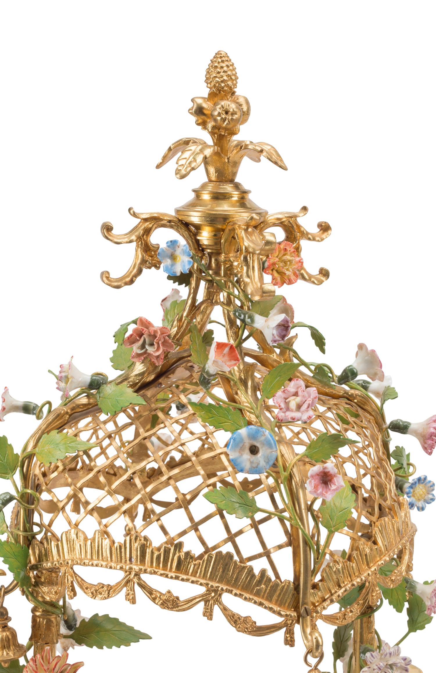 A Pair of French Gilt Bronze and Porcelain Figural Four-Light Candelabra