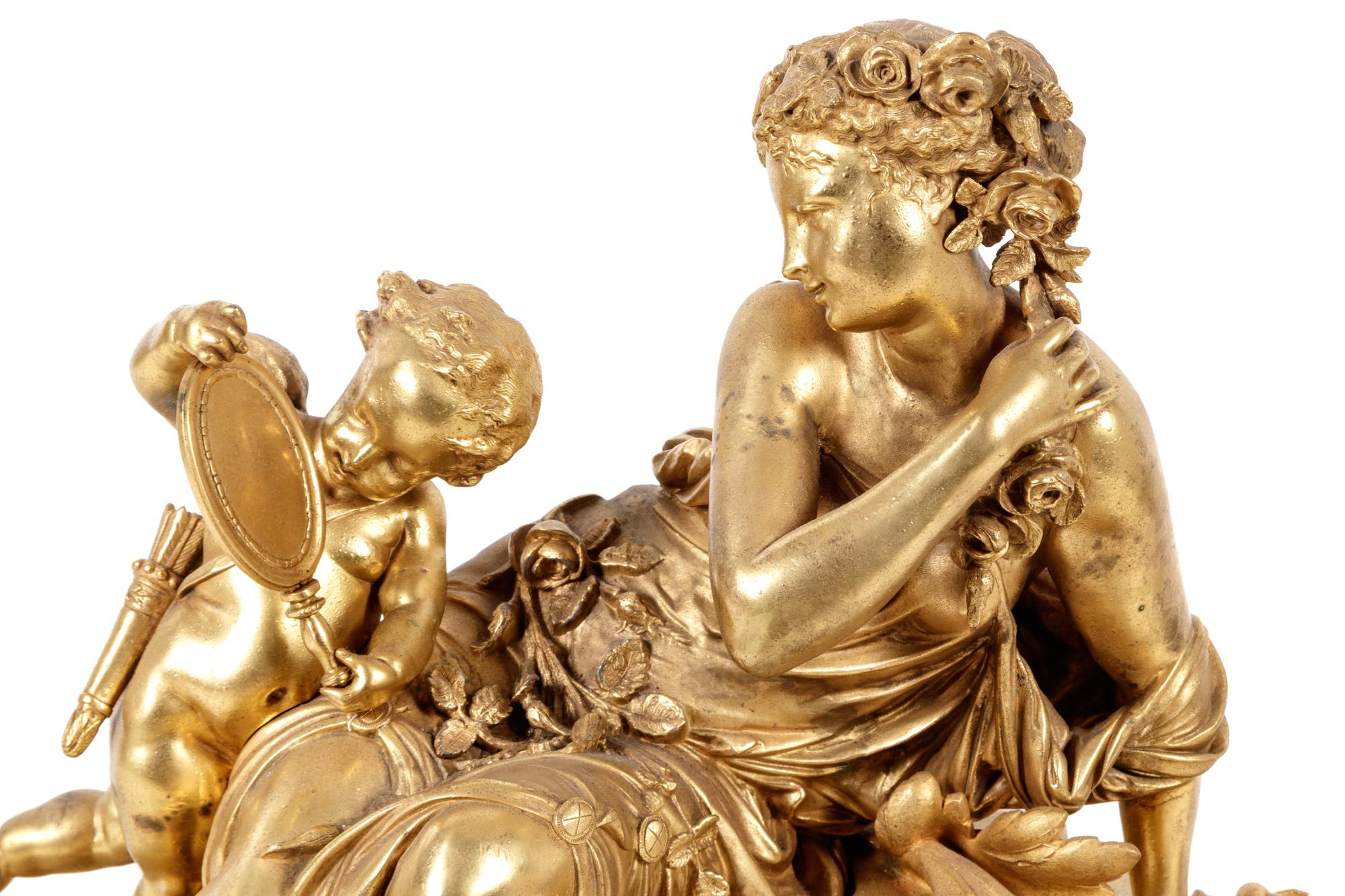 A Louis XV Style Gilt Metal Mounted Malachite Mantel Clock