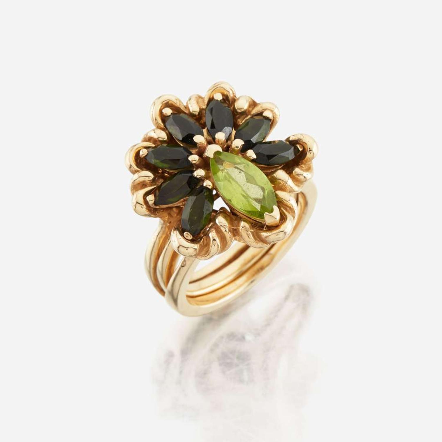 A peridot, green tourmaline, and gold ring