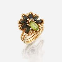 A peridot, green tourmaline, and gold ring