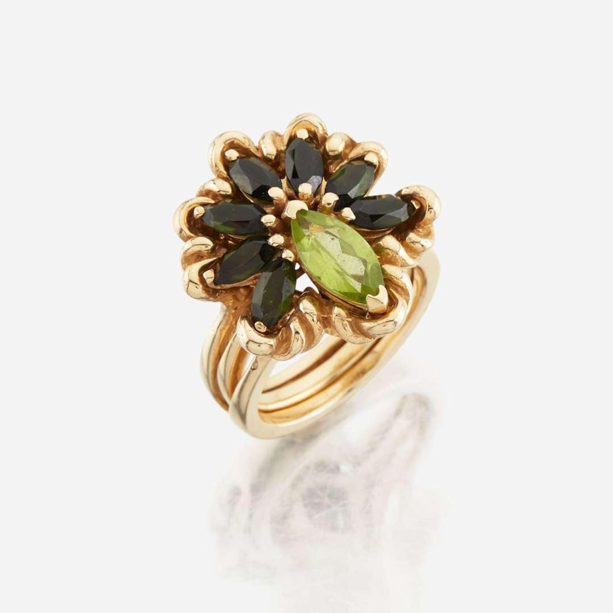 A peridot, green tourmaline, and gold ring