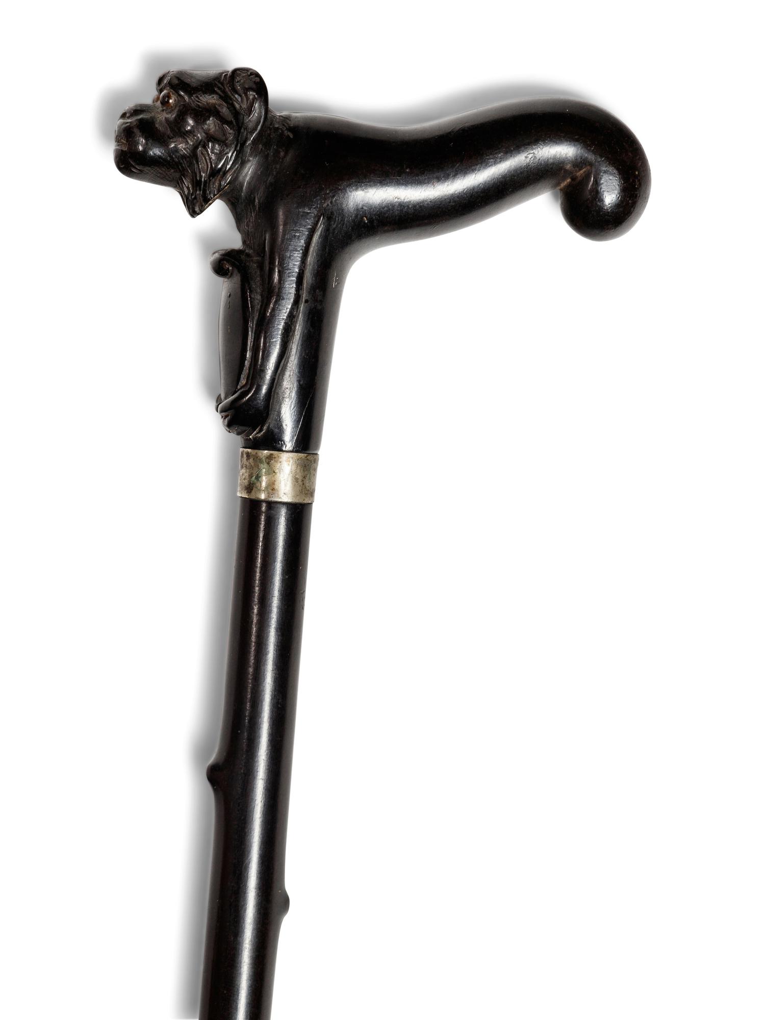 A Continental Carved Ebony Zoomorphic Walking Stick