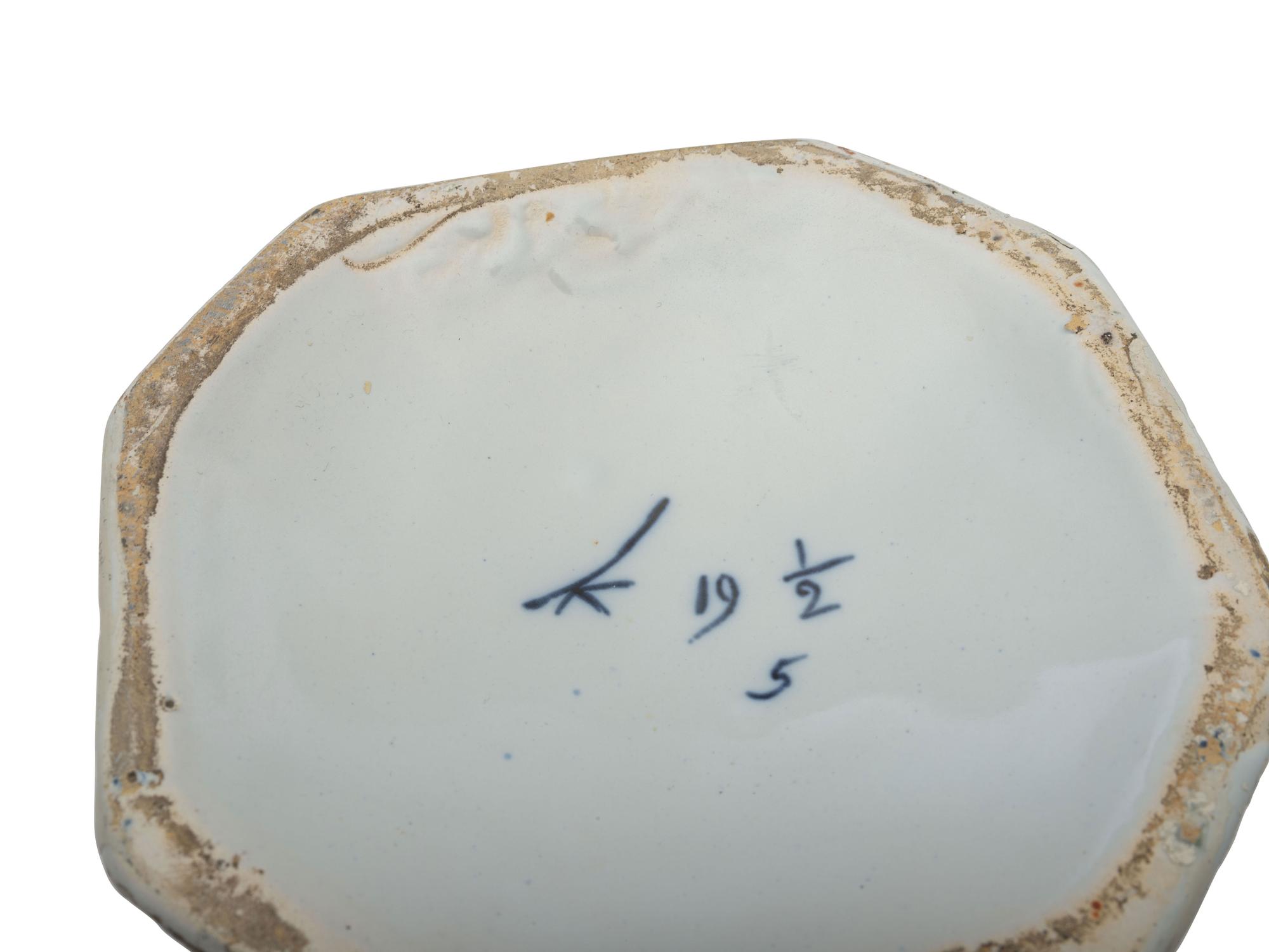 A Pair of Delft Earthenware Covered Vases and a Delft Charger