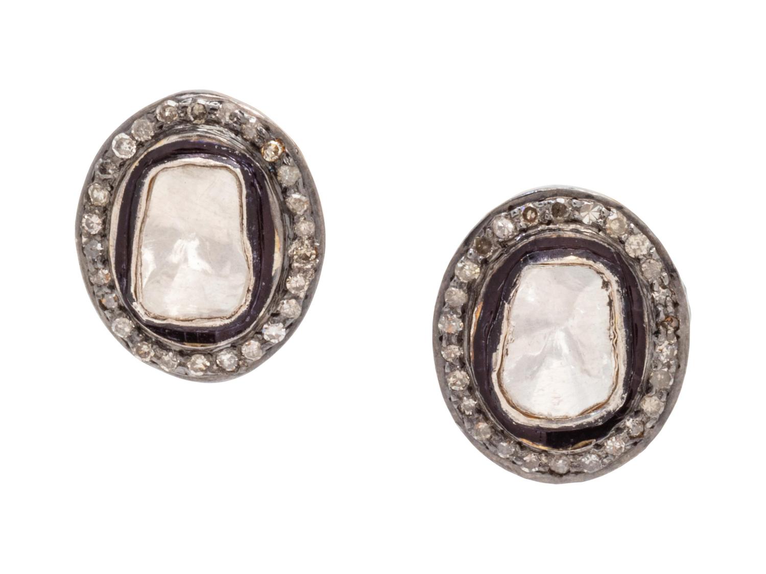 A Pair of Silver and Diamond Earrings,