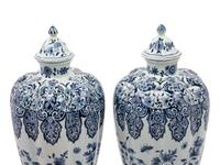 A Pair of Delft Covered Vases