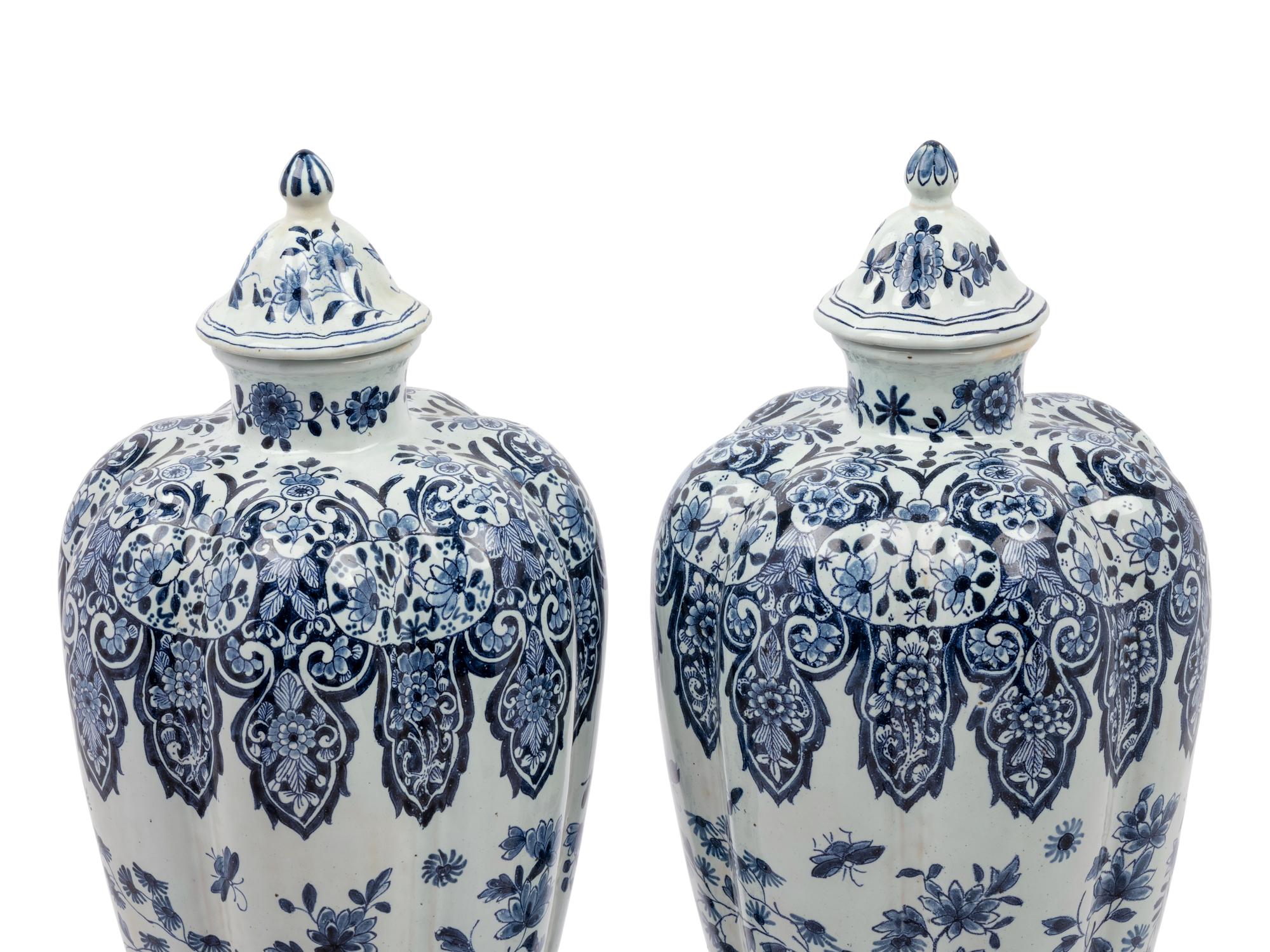 A Pair of Delft Covered Vases