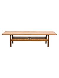Hans Wegner (Danish, 1914-2007), ANDREAS TUCK, 1955, table having a broad tabletop with a rounded and raised edge, the magazine shelf u