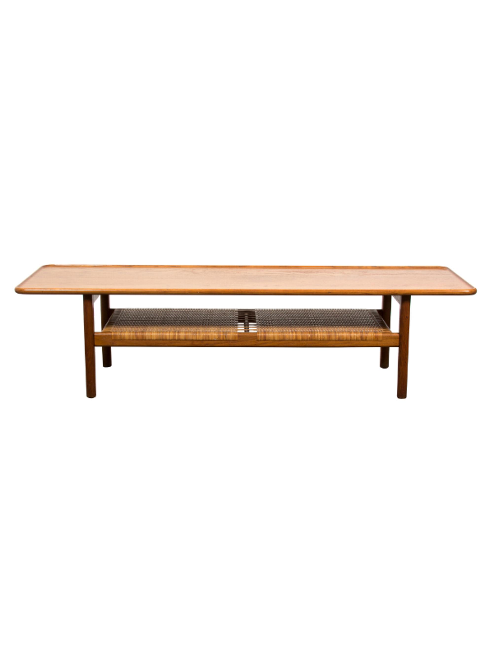 Hans Wegner (Danish, 1914-2007), ANDREAS TUCK, 1955, table having a broad tabletop with a rounded and raised edge, the magazine shelf u