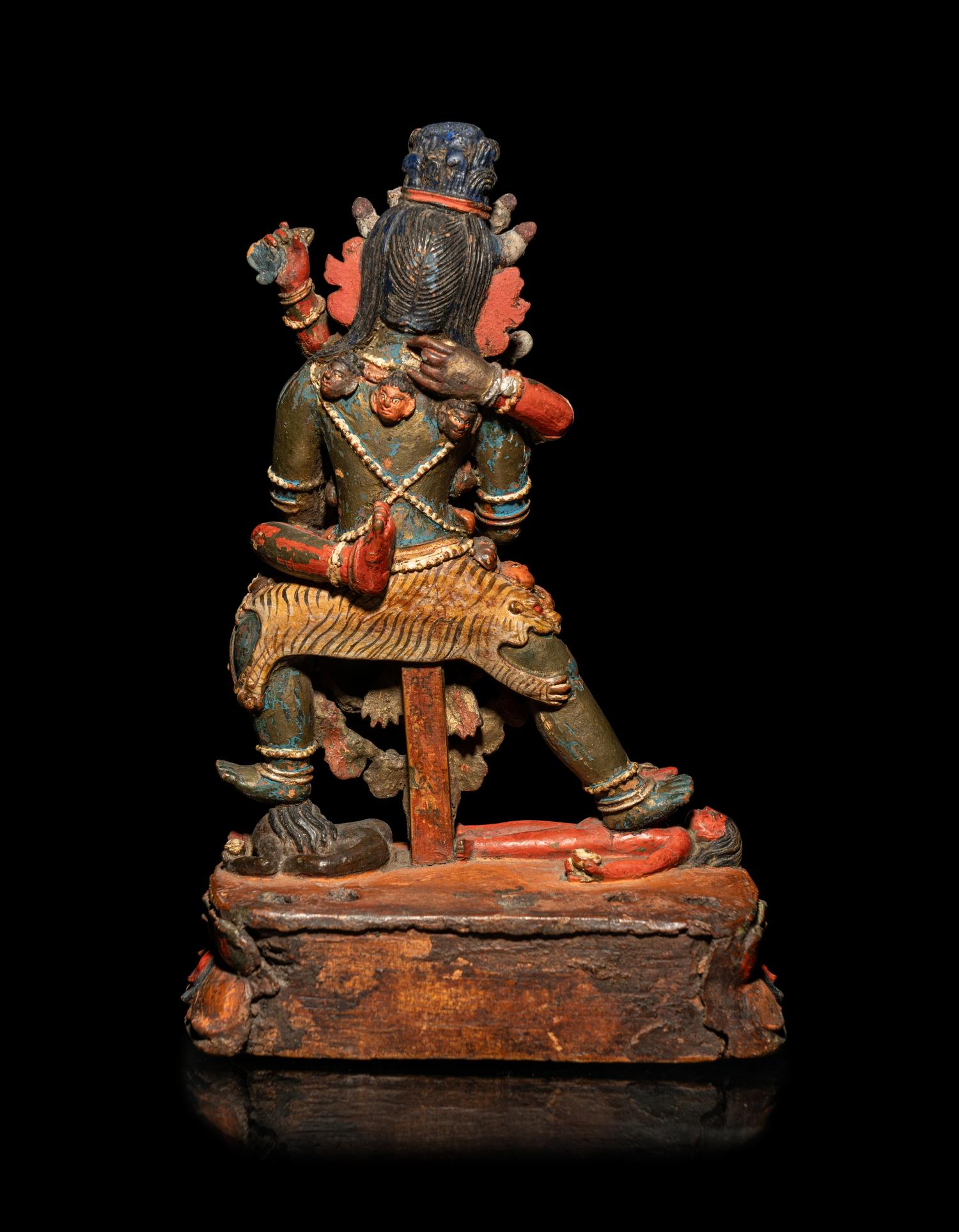 A Tibetan or Bhutanese Polychromed Wood Figure of Chakrasamvara and Consort