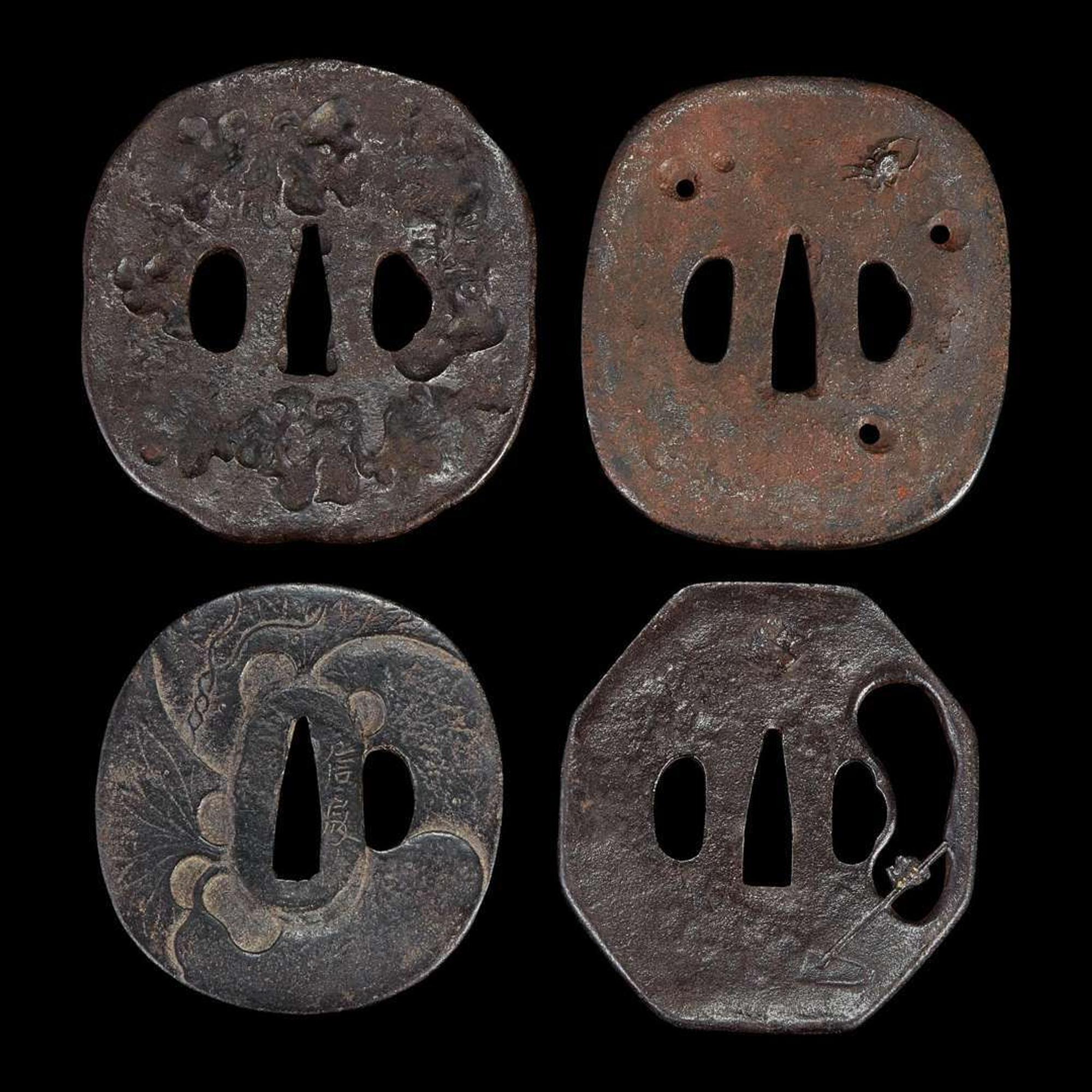 Group of twelve assorted Japanese iron tsuba