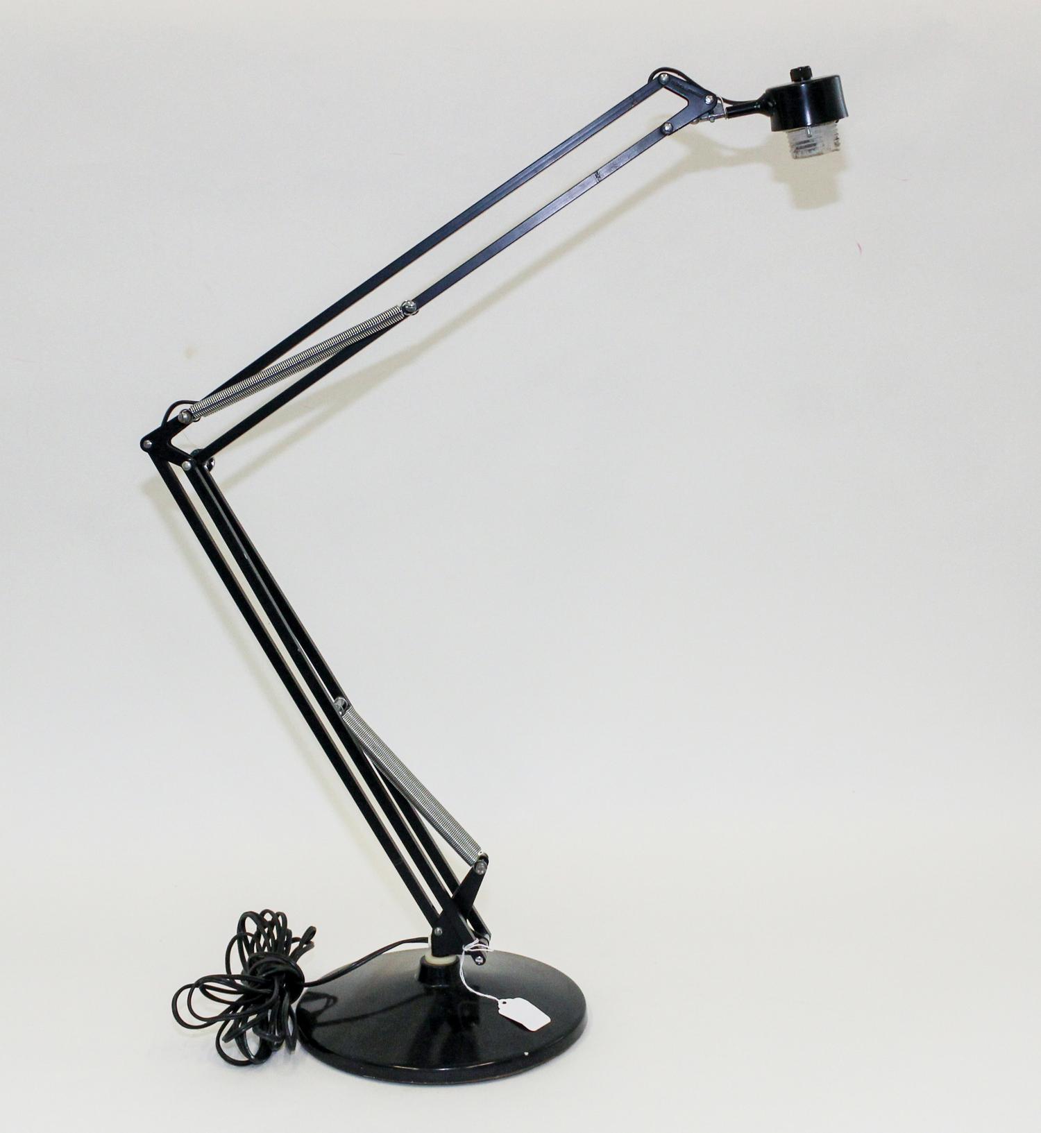 A Luxo Articulating Drafting Lamp Height 41 inches.