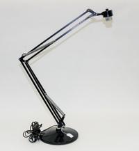 A Luxo Articulating Drafting Lamp Height 41 inches.