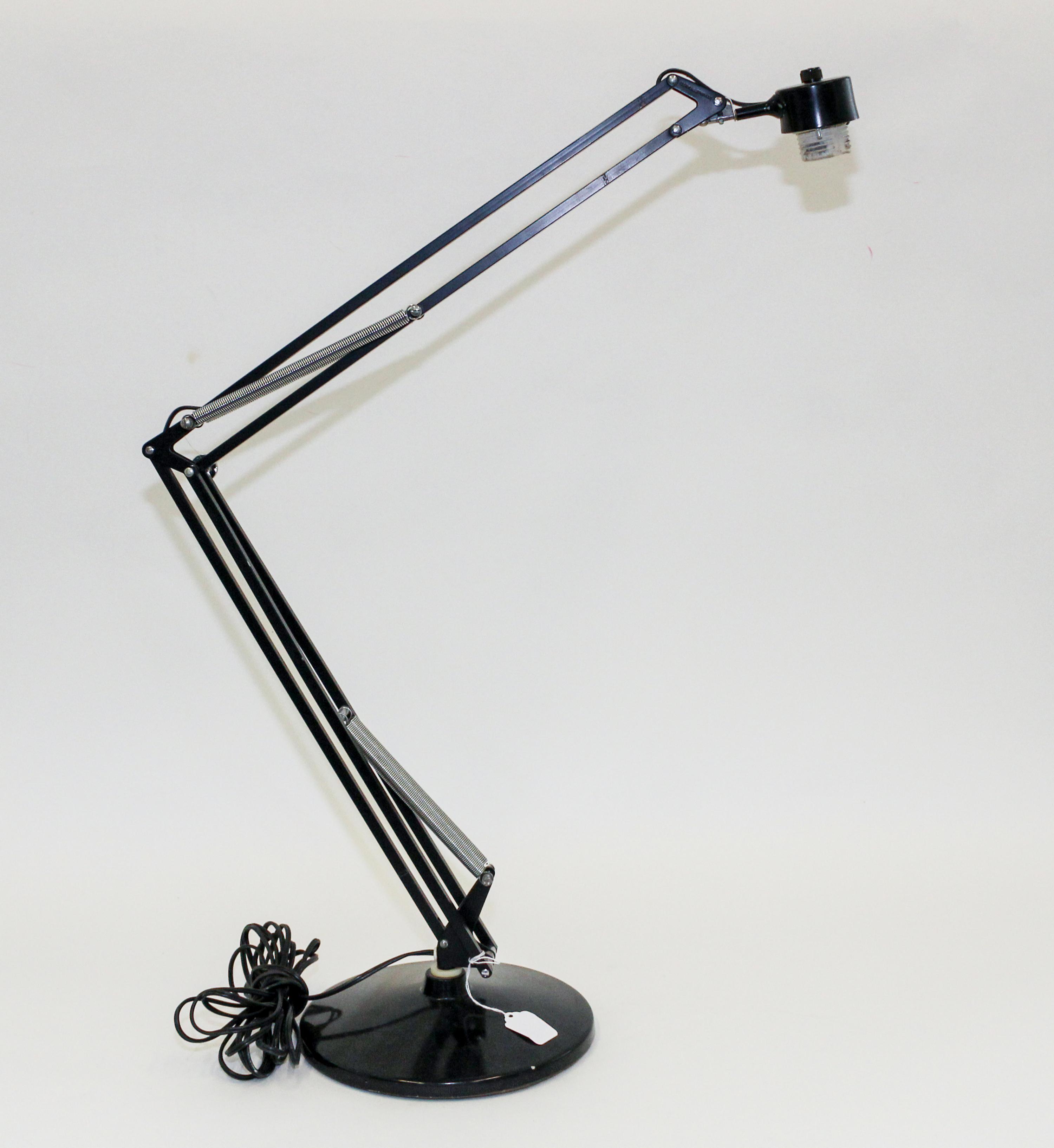 A Luxo Articulating Drafting Lamp Height 41 inches.