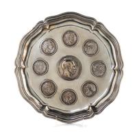 A German Silver Tray, 19th/20th Century, of shaped circular form, inset with eight 19th and 20th five-mark coins centered with a silver