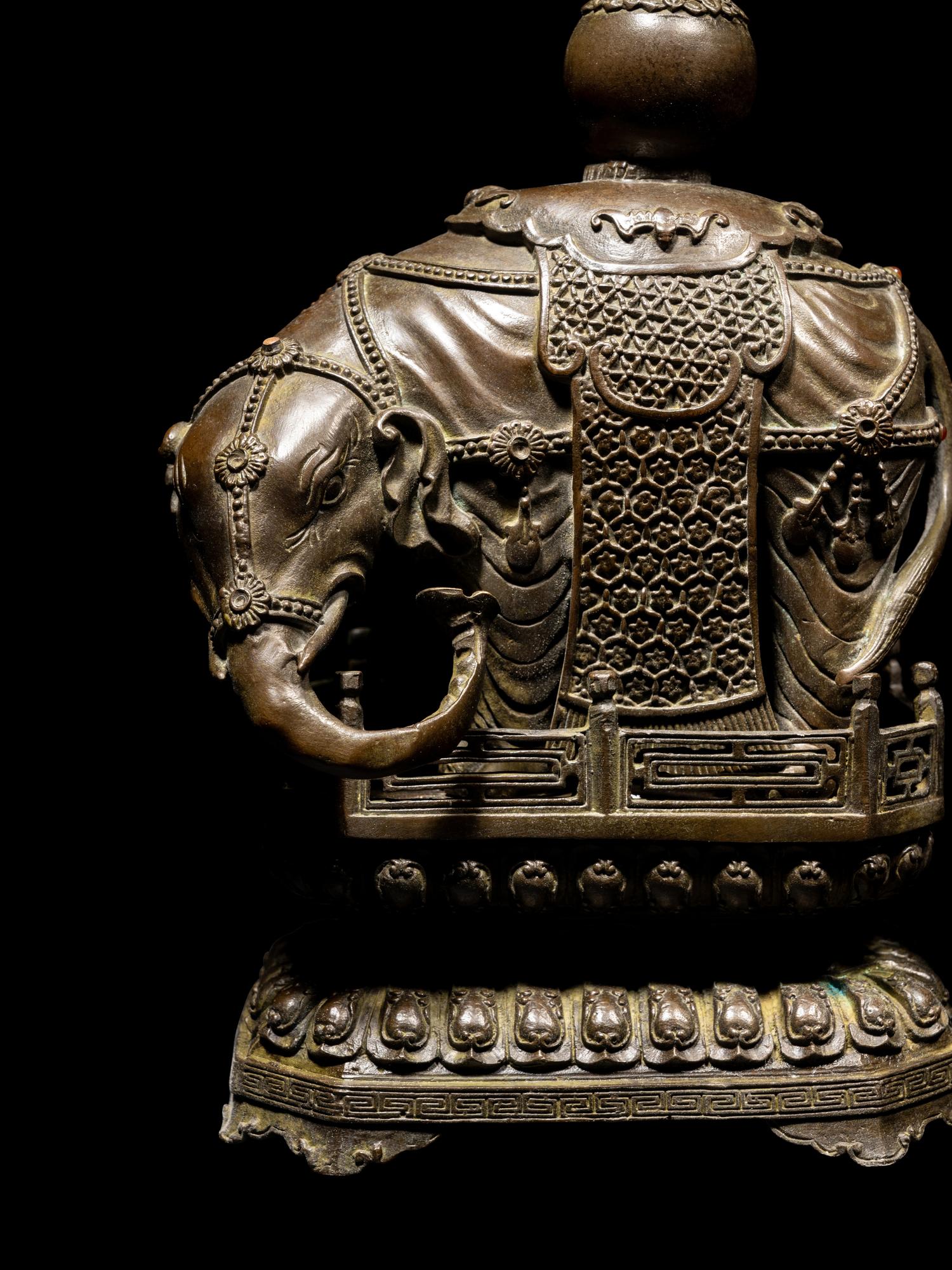 A Pair of Chinese Bronze Figures of Elephants