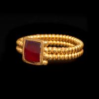A Roman Gold and Garnet Finger Ring with Cabochon