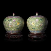 A Pair of Chinese Famille Rose Green Ground Covered Jars — 粉彩蘋果綠地纏枝花卉紋蓋罐一對