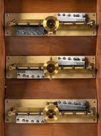 A Symphonion Style 38B Eroica Upright Three Disc Music Box with Clock