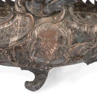 An Ornate Silverplate Centerpiece Bowl of Boat Form with Cherubs