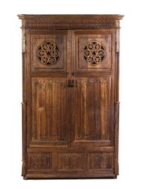 A Gothic Revival Oak Cupboard, Height 74 3/8 x width 46 x depth 21 1/2 inches.