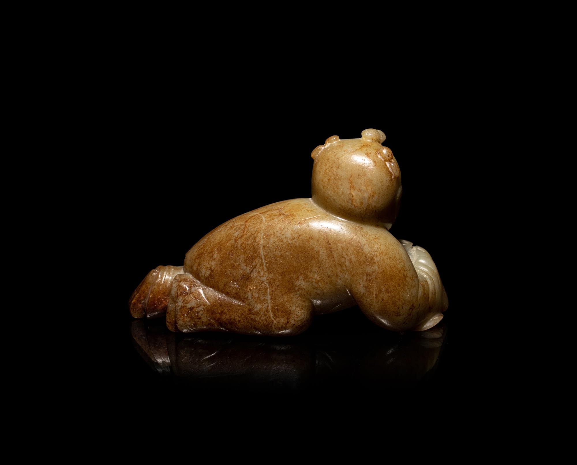 A Chinese Russet and Pale Celadon Jade Figure of a Boy