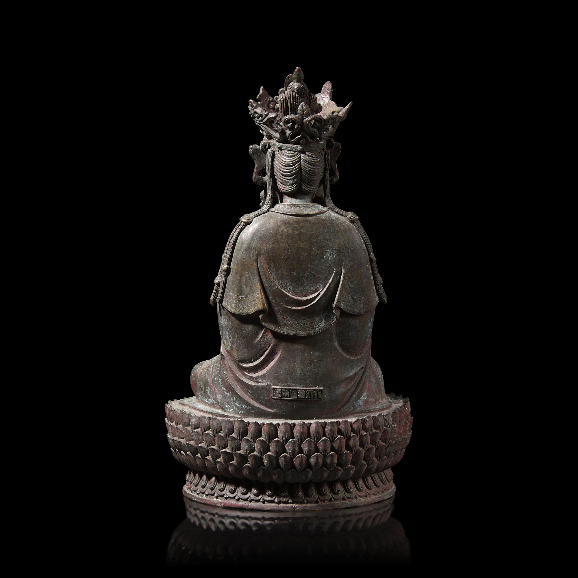 A Chinese Patinated Bronze Figure of a Seated Bodhisattva 銅觀音坐像