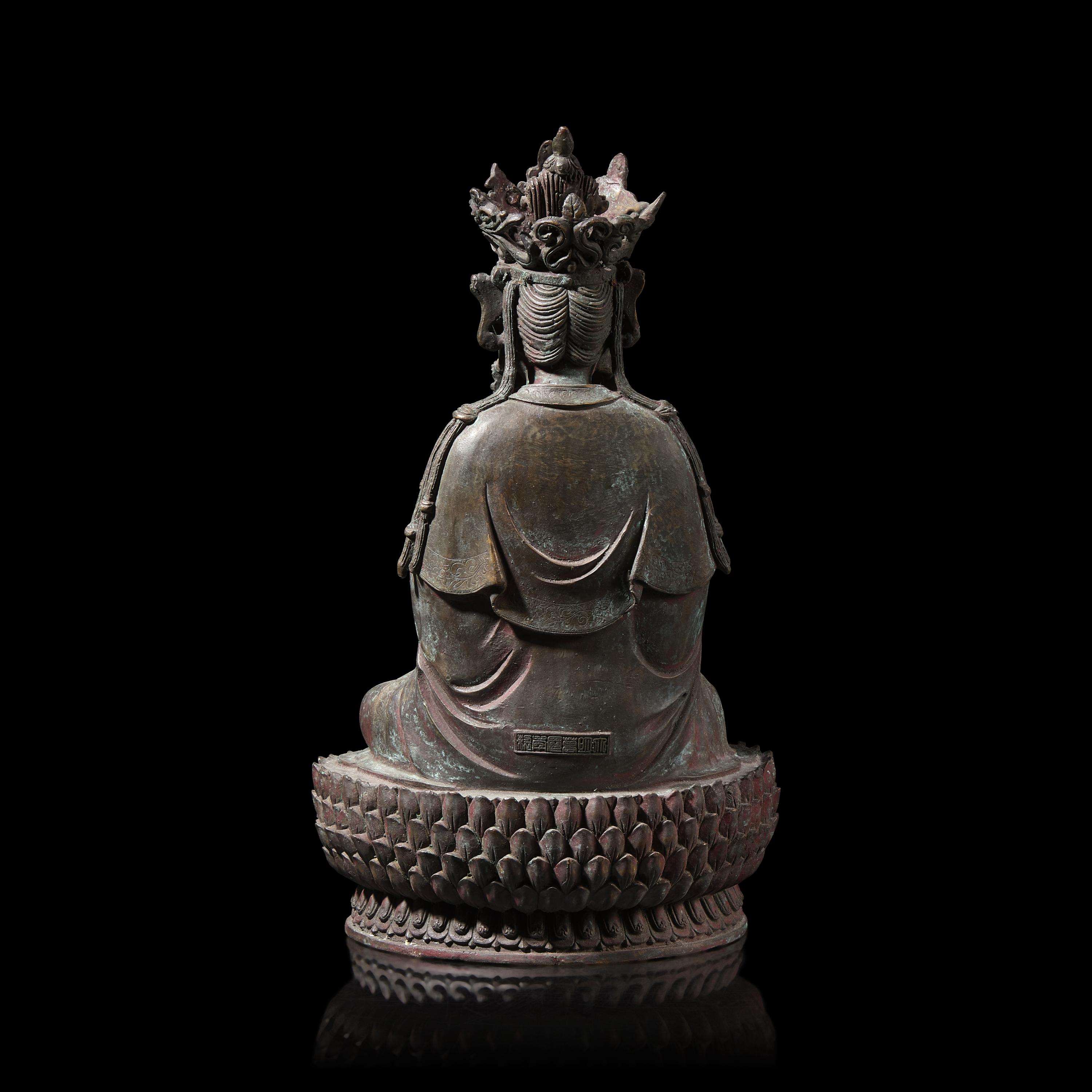 A Chinese Patinated Bronze Figure of a Seated Bodhisattva 銅觀音坐像