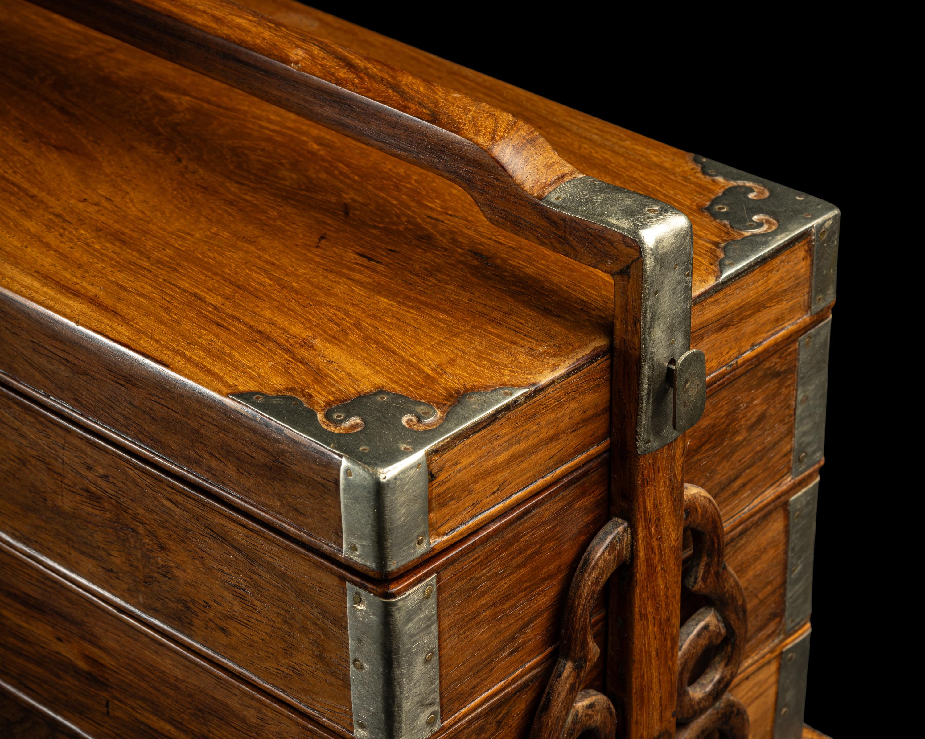 A Chinese Huanghuali and Mixed Wood Three-Tier Picnic Box, Tihe 黃花梨拼雜木三撞提盒