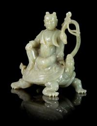 A Carved Hardstone Figural Group of an Immortal and a Tortoise Height 8 inches.