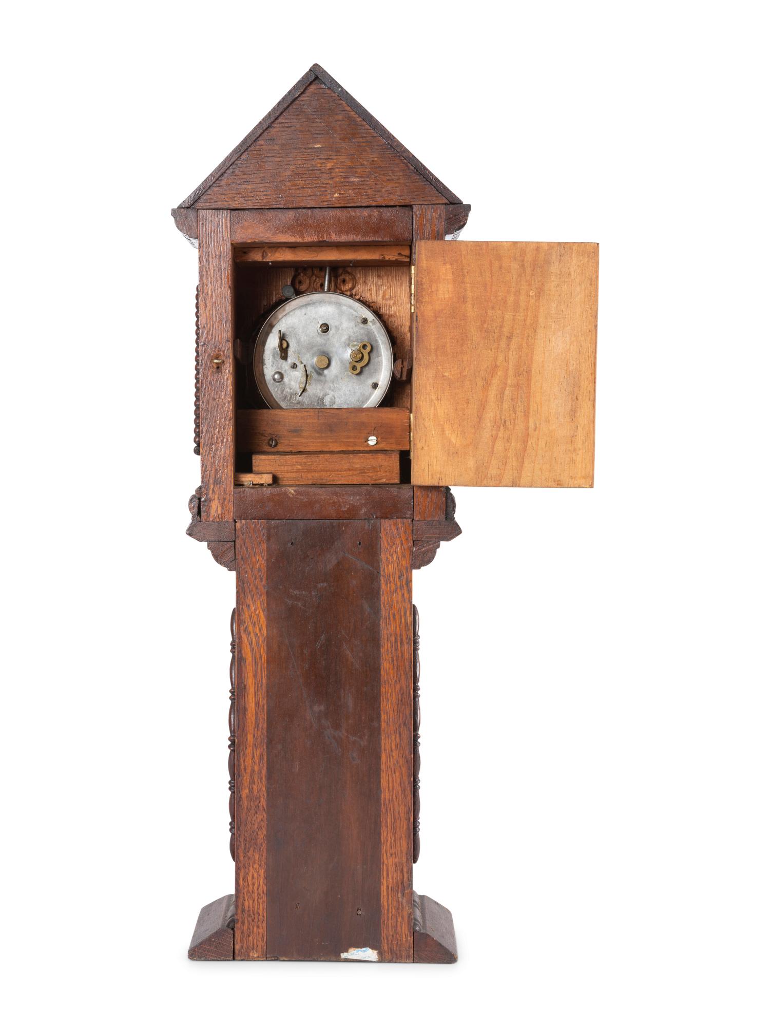 A Miniature Carved Tall Case Clock