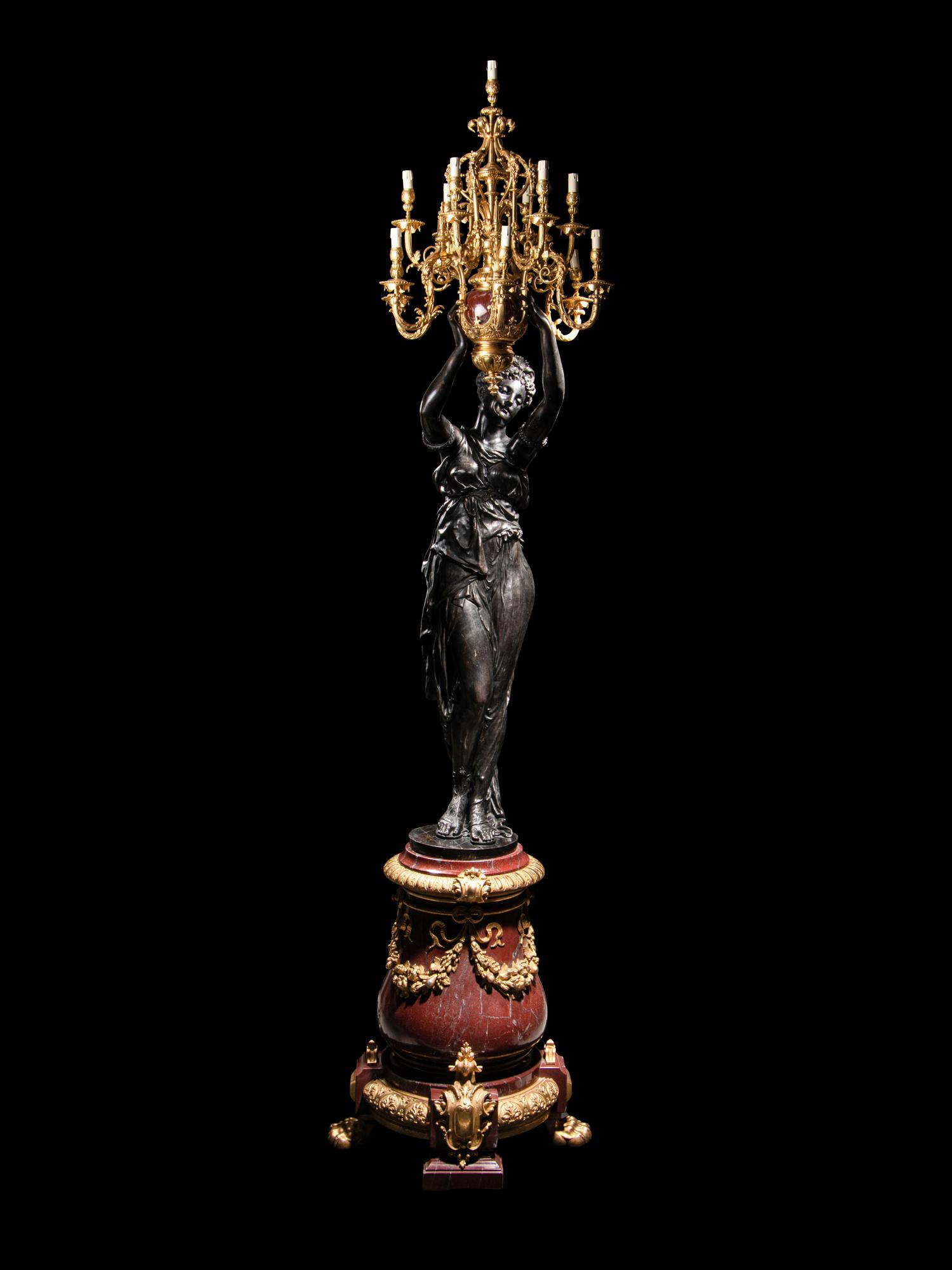 A Pair of Monumental Gilt and Patinated Bronze and Rouge Marble Figural Torchères