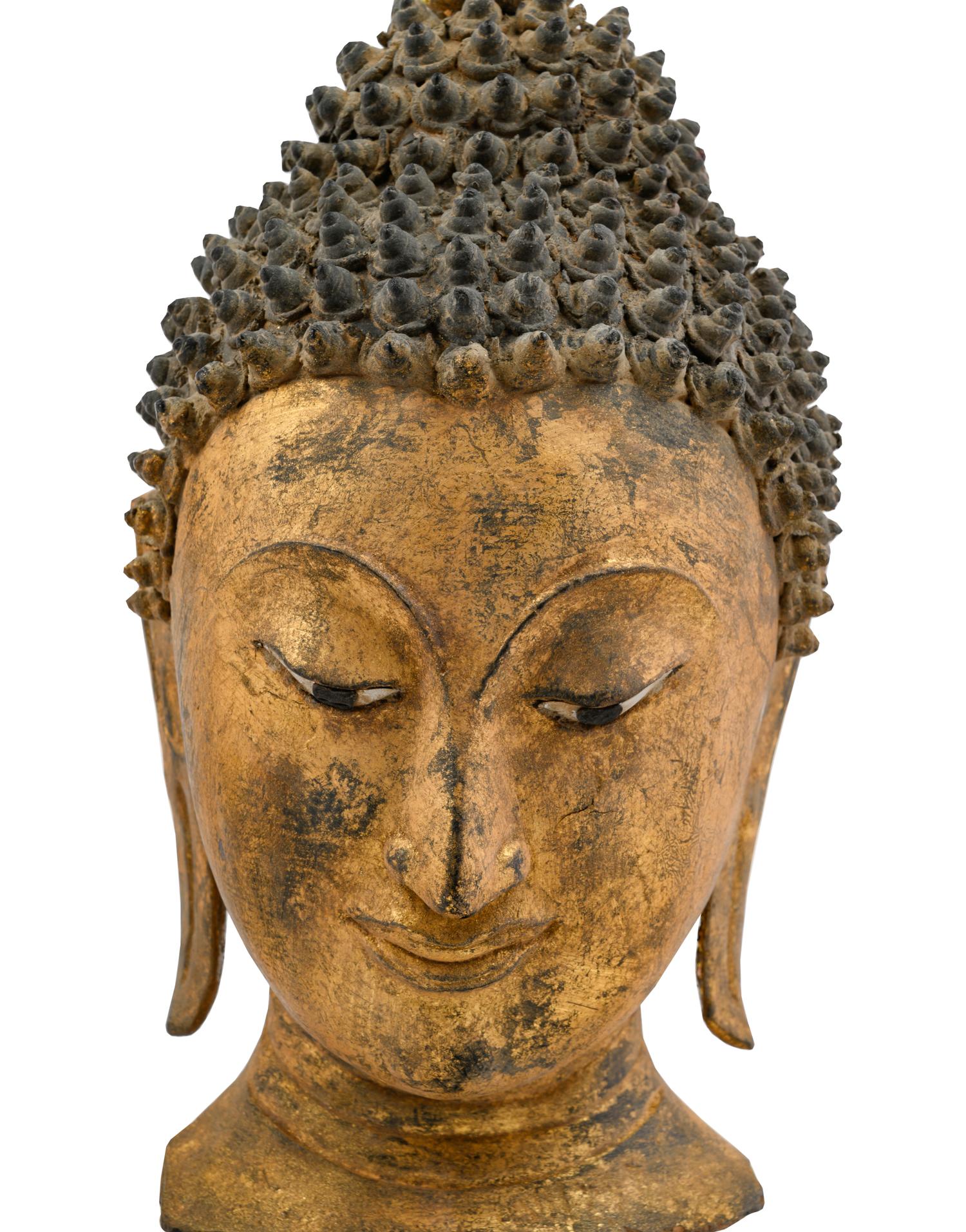 A Thai Gilded Carved Wood Buddha Head