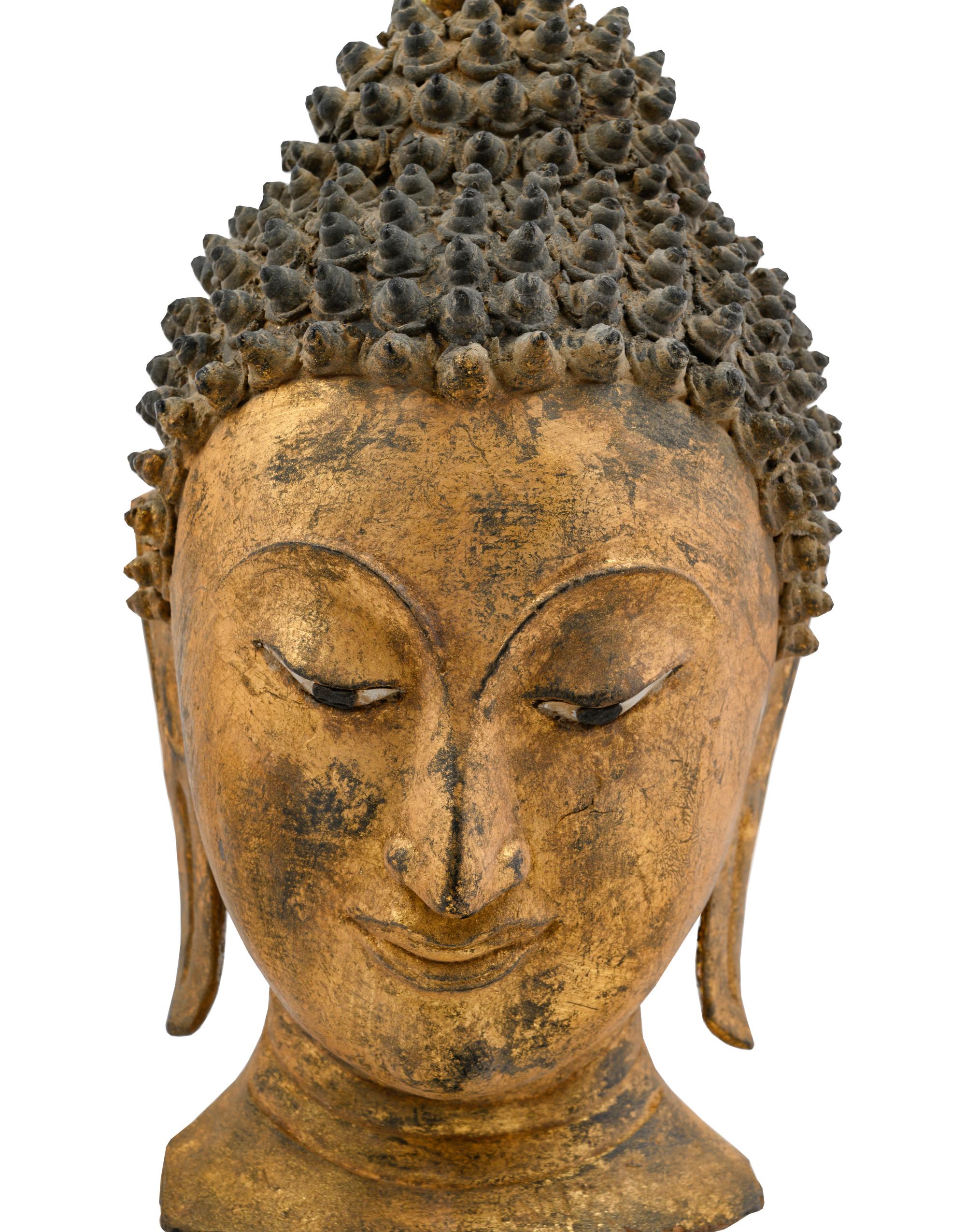 A Thai Gilded Carved Wood Buddha Head