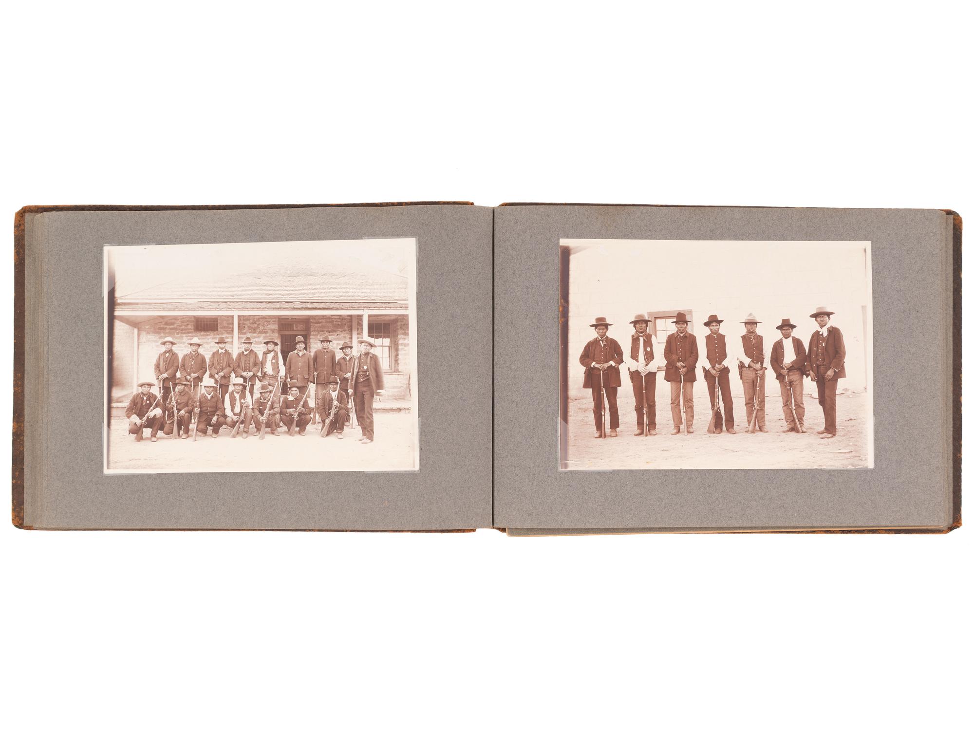 [NATIVE AMERICANS]. JONES, John Edward (1863-1922), photographer. Album containing 50 photographs of the San Carlos Indian Agency, including Apache civilians and police, agency buildings and dwellings, and scenic views. Ca 1904.