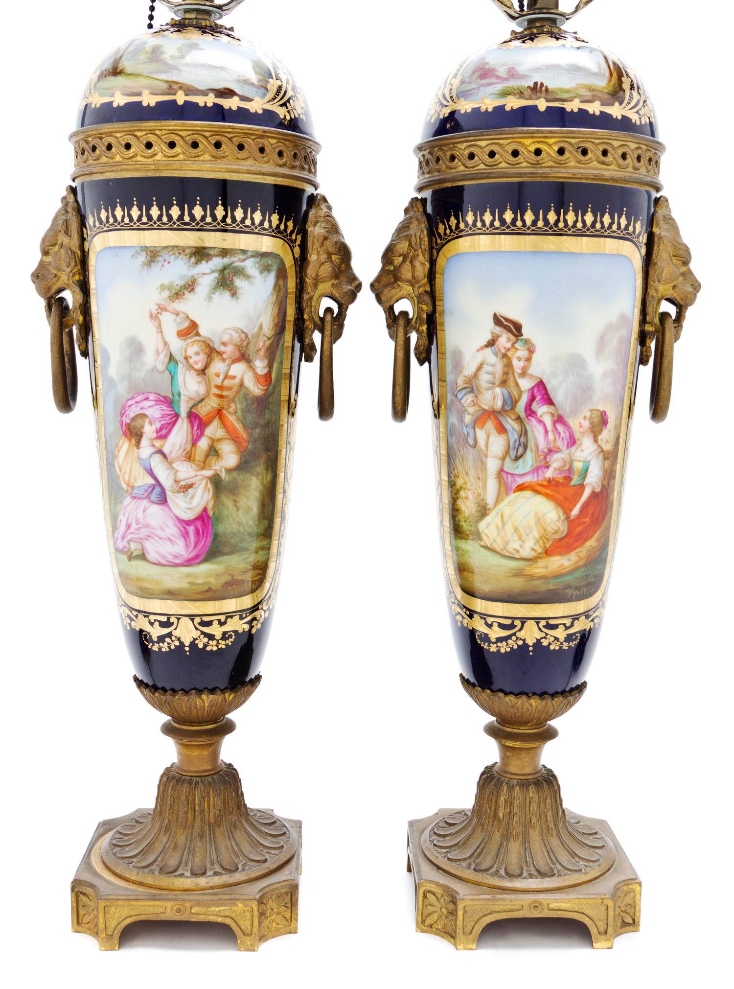 A Pair of Sevres Style Porcelain and Gilt Bronze Mounted Urns, Height 16 1/2 inches.