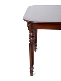 A Regency Style Inlaid Mahogany Dining Table
