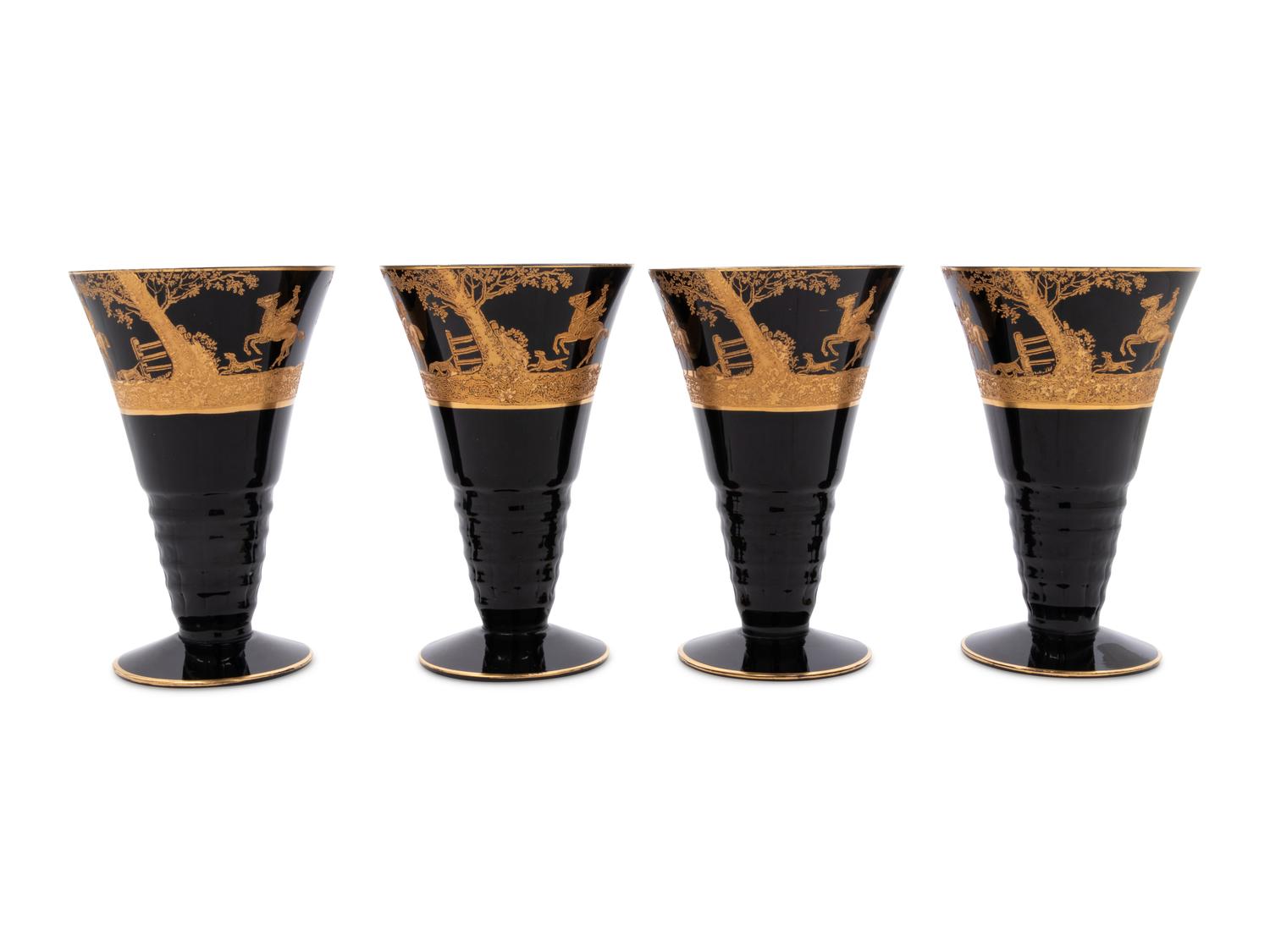 Four Continental Gilt Decorated Dark Amethyst Glass Goblets Depicting Hunting Scenes