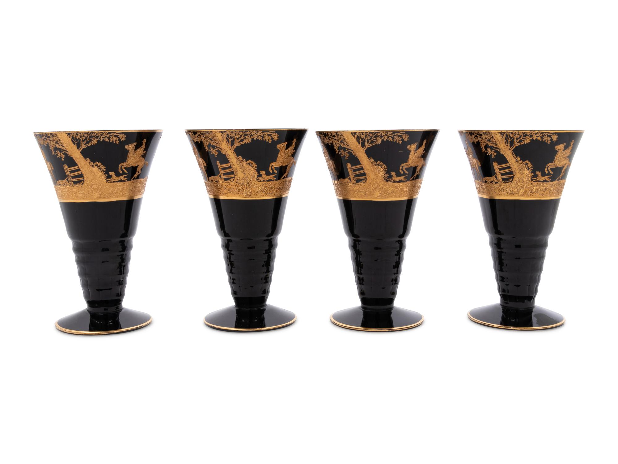 Four Continental Gilt Decorated Dark Amethyst Glass Goblets Depicting Hunting Scenes