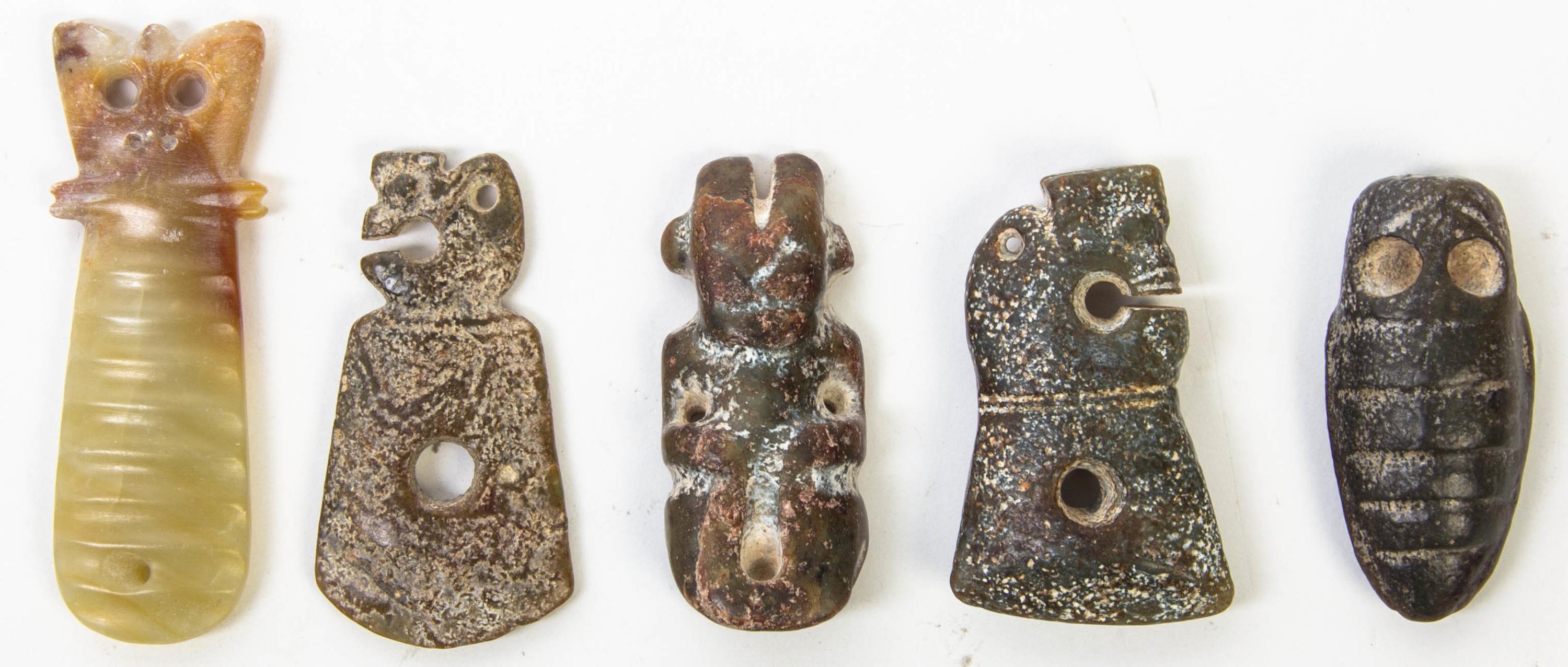 A Group of Five Carved Hardstone Toggles Height of tallest 3 3/8 inches.