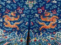 A Chinese Blue Ground Embroidered Silk Dragon Robe, Jifu, Late 19th Century 清晚期 藍緞地綉云龍紋吉服