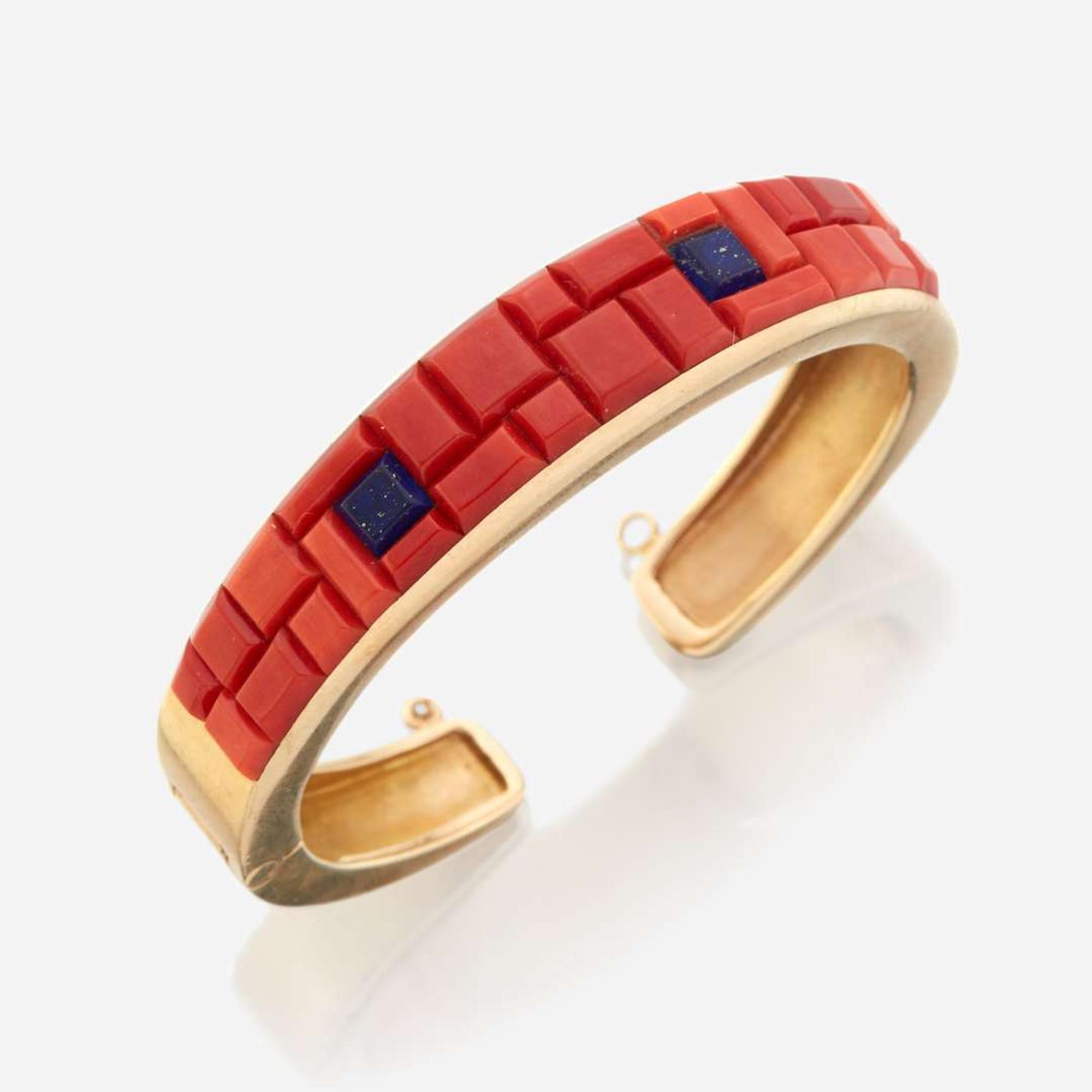 A gold, coral, and lapis lazuli cuff bracelet