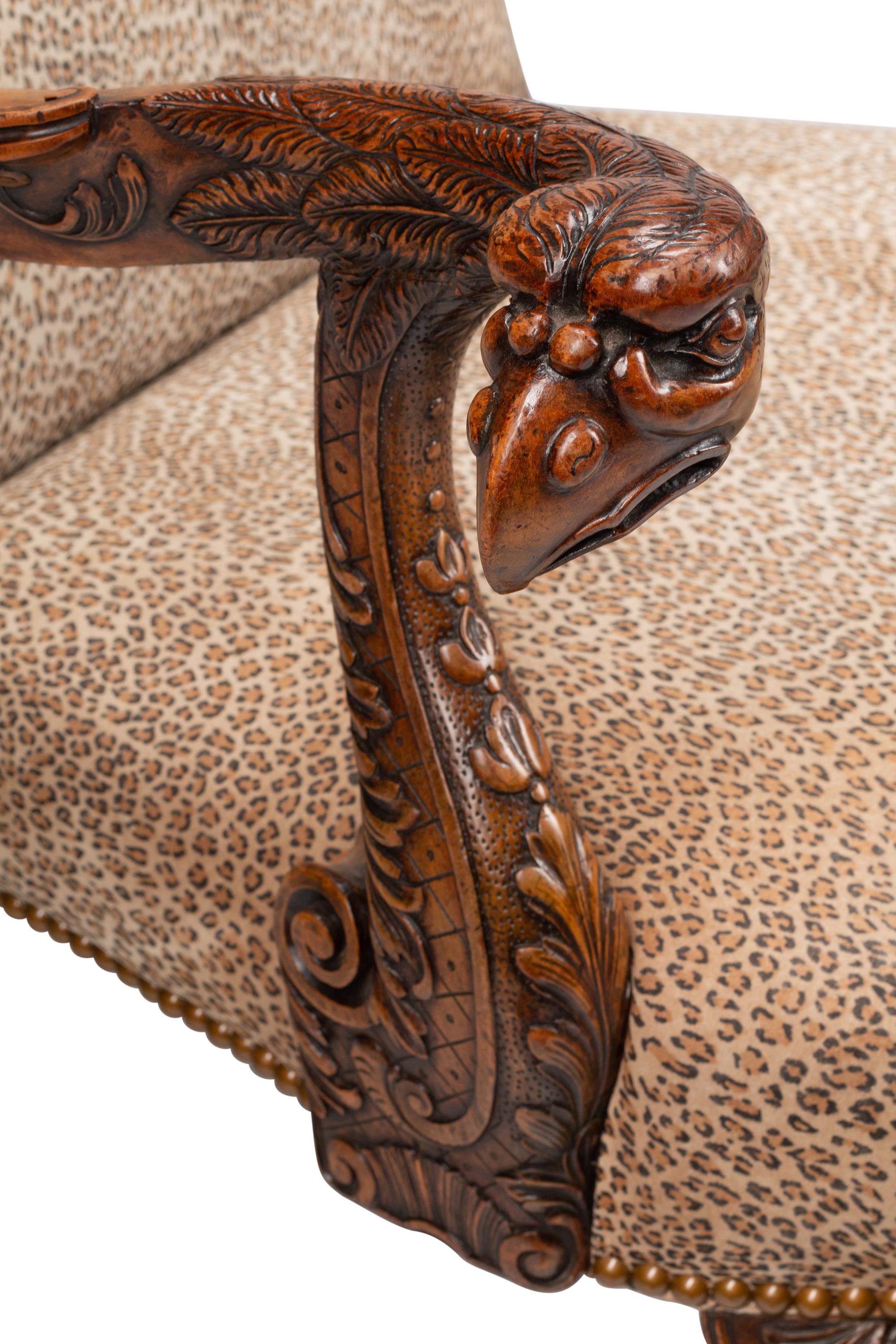 A Pair of George III Style Carved Walnut Library Armchairs