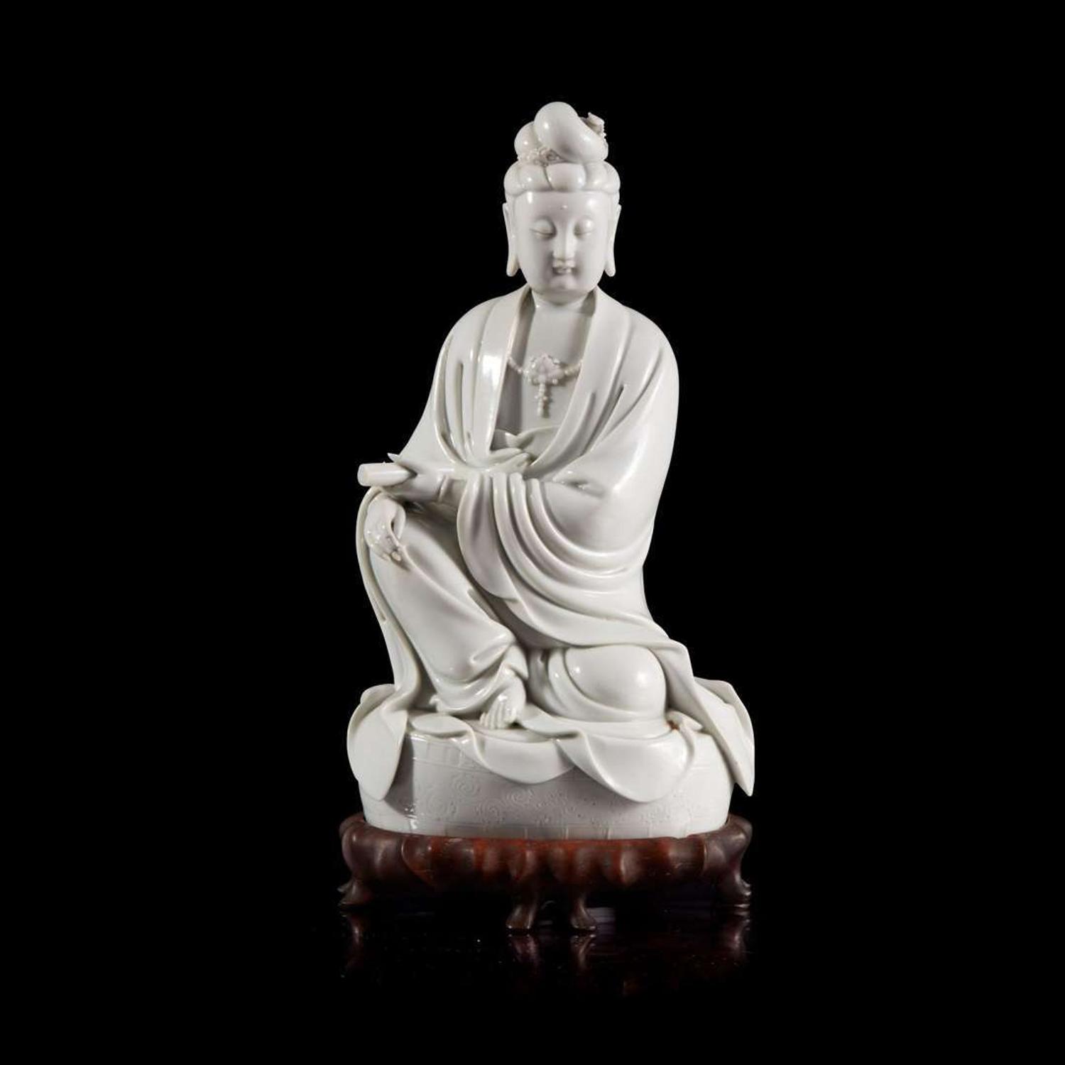 A Chinese blanc de chine figure of Guanyin 德化窑观音造像 "Dehua" and "Puji Yuren" mark ”??“ ? “????” ??