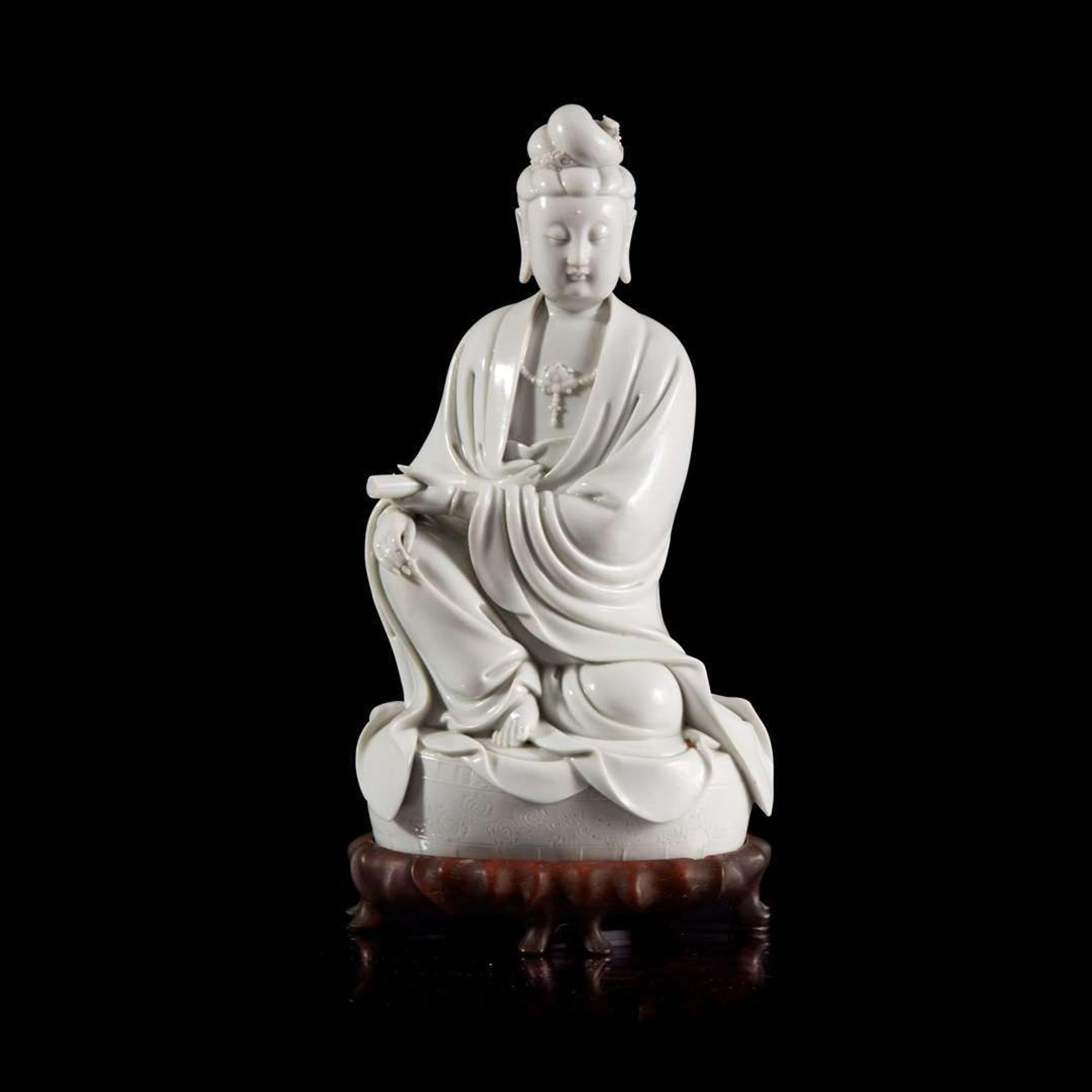 A Chinese blanc de chine figure of Guanyin 德化窑观音造像 "Dehua" and "Puji Yuren" mark ”??“ ? “????” ??