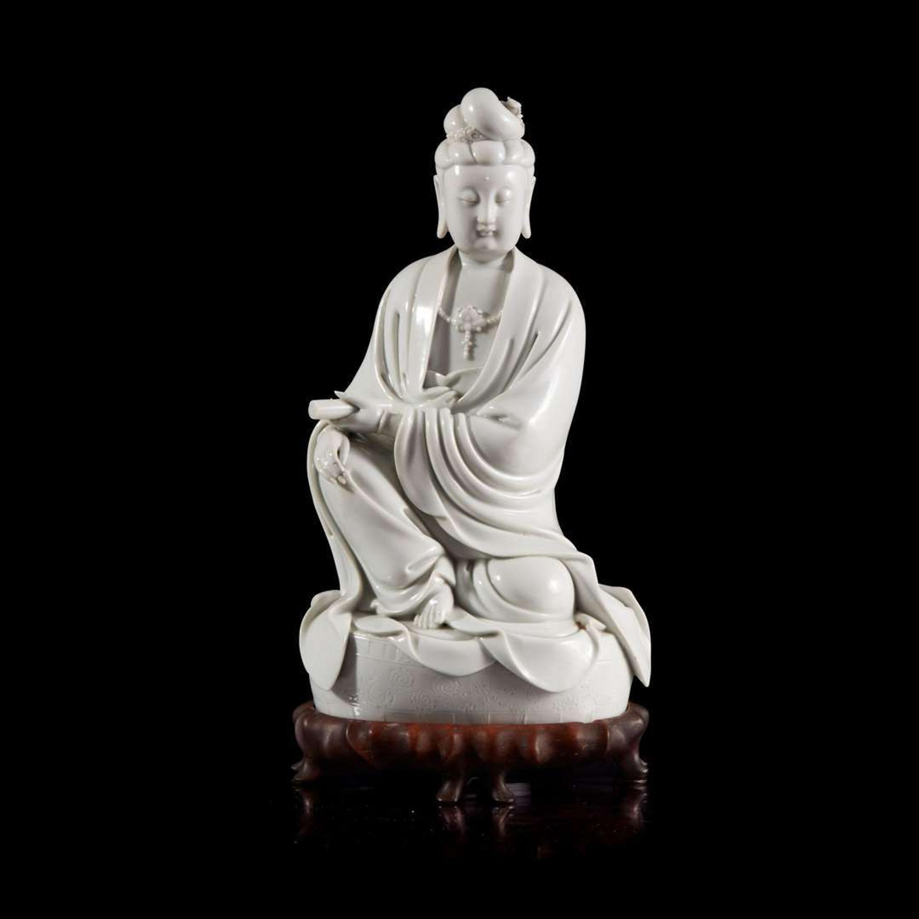 A Chinese blanc de chine figure of Guanyin 德化窑观音造像 "Dehua" and "Puji Yuren" mark ”??“ ? “????” ??