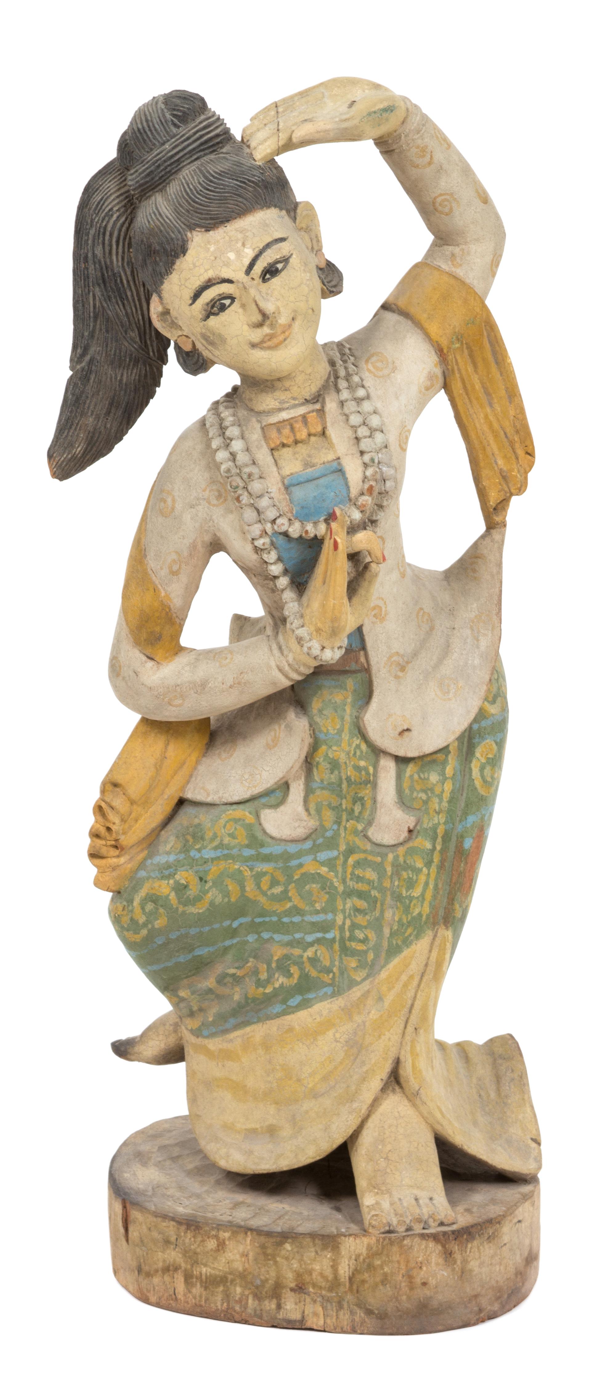 A Southeast Asian Carved Wood and Polychrome Dancing Figure Height 35 inches. — 20TH CENTURY