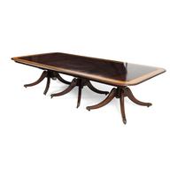 A Regency Style Mahogany and Satinwood Three-Pedestal Dining Table