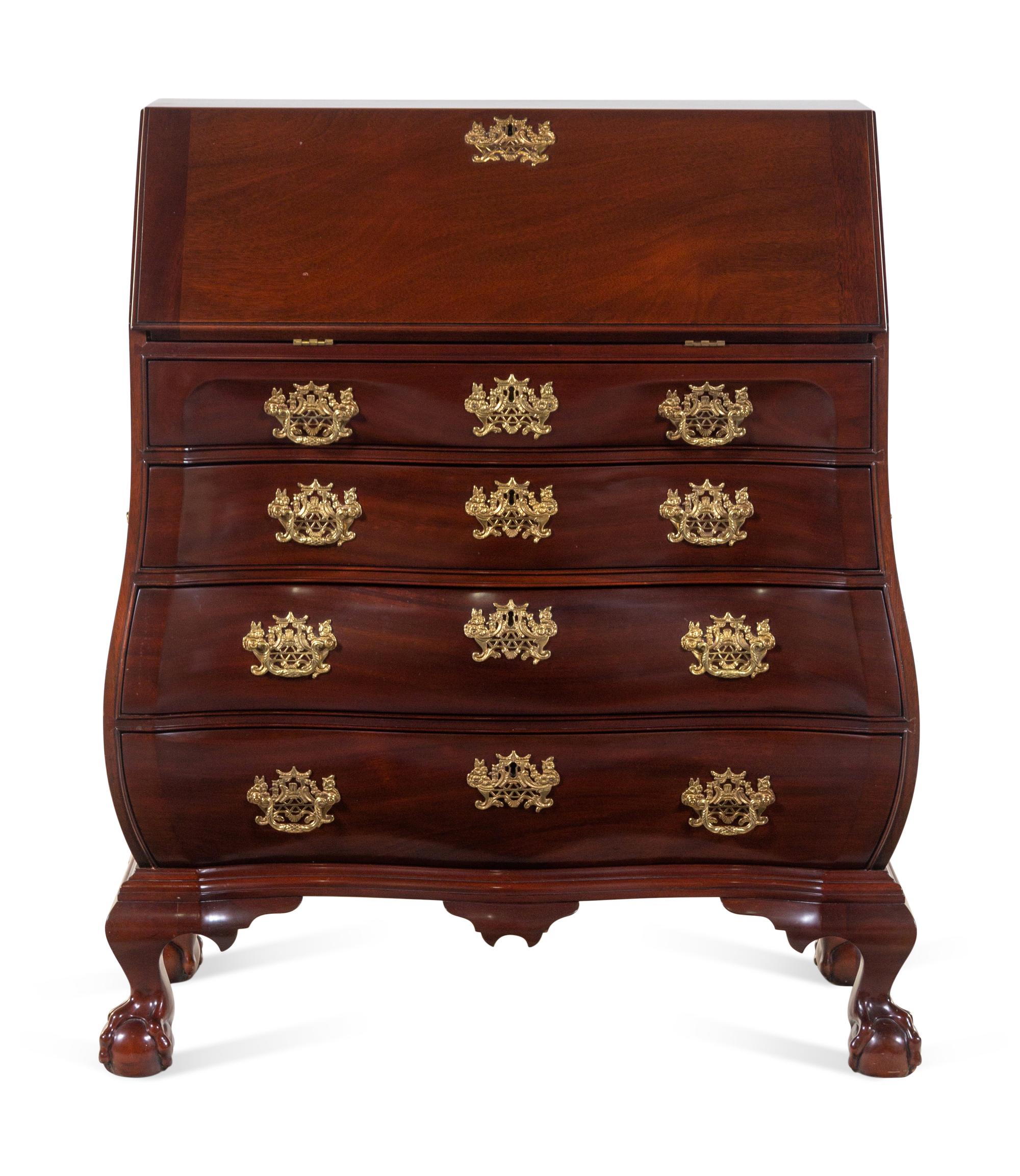 A Chippendale Style Carved Mahogany Bombe-Form Slant-Front Desk